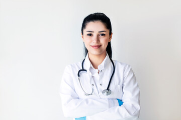 Portrait of female doctor on light background