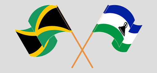 Crossed and waving flags of Jamaica and Kingdom of Lesotho