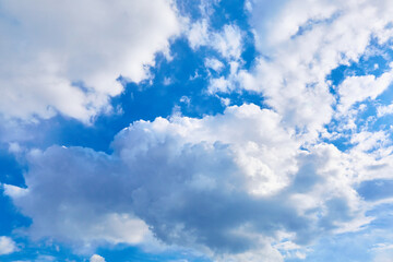 Blue sky with white cumulus clouds. Banner. Background. Nature wallpaper. Sunny weather forecast. Religion concept. Heaven landscape. Outdoor scenic. Bright pattern design. Copy space. Fresh air.