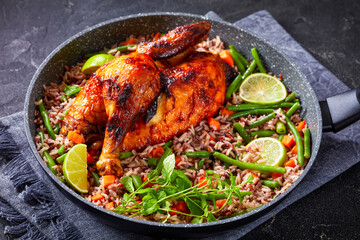 Roasted Half Chicken with brown rice in a skillet