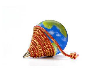 Top spinning planet earth on white background. ( The planet earth globe is a physical hand made model and digital photoshop edited by the photographer )