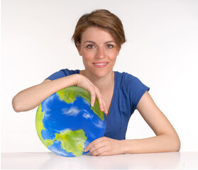 Young woman hold a planet earth globe on care concept.( The planet earth globe is a physical hand...
