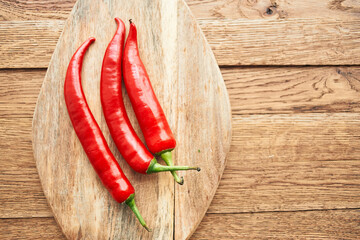 red hot chili peppers on a wooden board kitchen ingredients