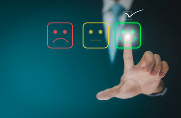 Businessman people are touching the virtual screen on the happy and unhappy Smile face icon in service in the black background, Customer service and Satisfaction concept ,