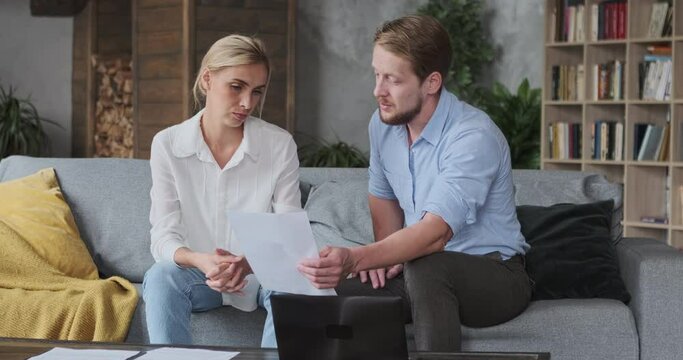 Woman client and man lawyer discuss paper document credit agreement payment alimony divorce marriage contract. Business partners checking deal paperwork accountant company bills indebtedness
