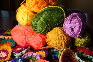 Colorful knitting wool yarn balls and skeins of yarn, hobby material. Handmade knitted, crocheted...