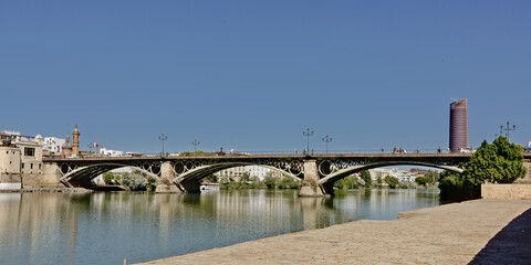 Fototapeta na wymiar Triana bridge over Guadalquivir river in Seville, Spain