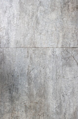 vertical image of the gray texture of a tile