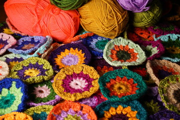 Colorful knitting wool yarn balls and skeins of yarn, hobby material. Handmade knitted, crocheted...