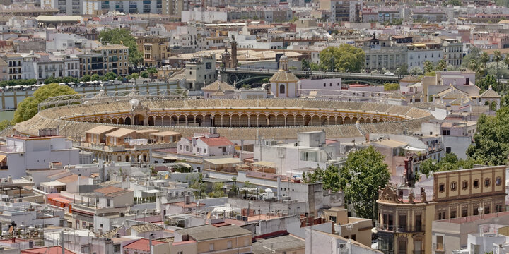 Aerial view on a r the center of the city of Seville , Spain, with the Plaza de toros de la Real Maestranza de Caballer&iacute;a , bullfighting ring