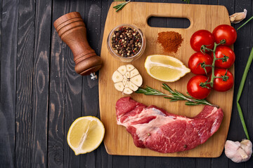 meat vegetables ingredients on a wooden board beef