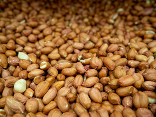 Peanut background. Healthy diet. Lots of nuts in the box.