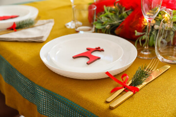 Dining table with setting for Christmas celebration indoors
