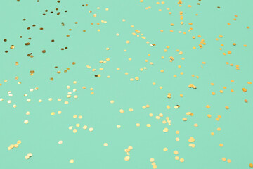 Beautiful golden confetti on color background