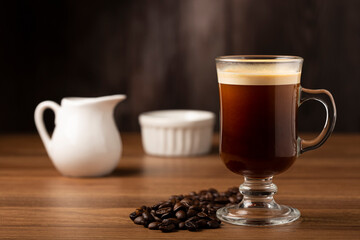 Espresso and coffee beans on the table.