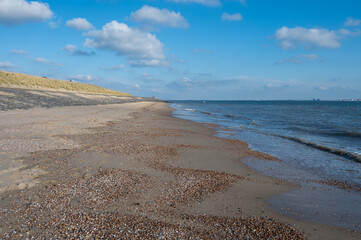 View on white sandy  beach, dunes and water of North sea between Vlissingen en Domburg, Zeeland, Netherlands