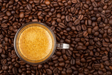 Espresso and coffee beans on the table.