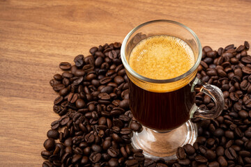 Espresso and coffee beans on the table.