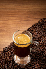 Espresso and coffee beans on the table.