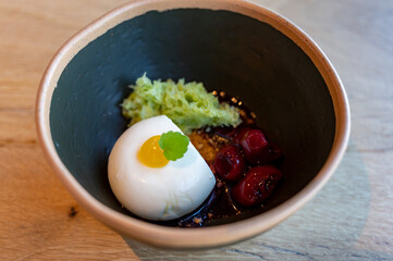 Tasty lemon mousse cream with sour cherry dessert