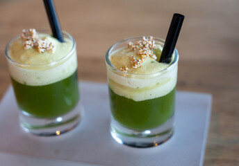 Healthy fresh cucumber mousse with whipped cream and sesame, served in glass