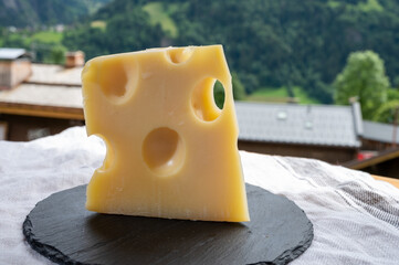Cheese collection, French cow cheese emmental and french mountains village in Haute-Savoie on...