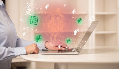 Doctor working on laptop with healthcare concept