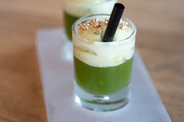 Healthy fresh cucumber mousse with whipped cream and sesame, served in glass