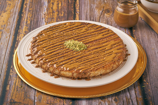 Arabian Traditional Desserts - Cream and cheeses with and pistachio nuts on top