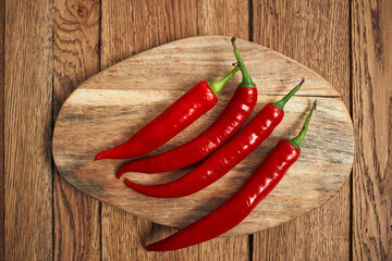 red hot chili peppers on a wooden board kitchen ingredients