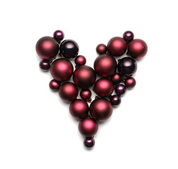 Heart made of beautiful Christmas balls on white background
