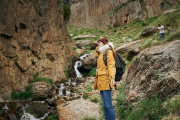 woman hiker with backpack mountains travel adventure freedom