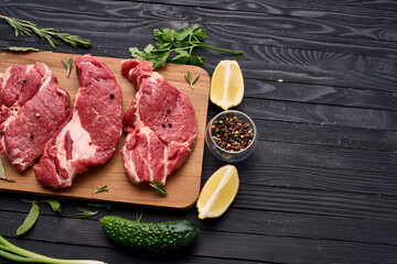 meat vegetables ingredients on a wooden board beef