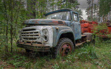 Soviet retro truck rusting in the woods