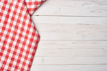 Red checkered tablecloth wooden background texture kitchen decoration