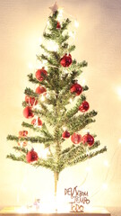 Christmas baubles with lighting and red polka dots hanging on the Christmas tree. Message: God is good all the time. Christmas. Christmas ornaments.