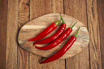 red hot chili peppers on a wooden board kitchen ingredients