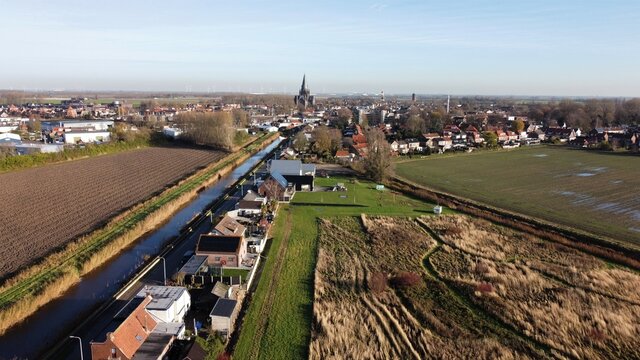 Steenbergen in Brabant, Netherlands with the well-known characteristic Roman Catholic Church Saint Gummarus from 1901 in Gothic style fairytale-like on the horizon.