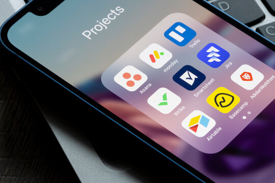 Portland, OR, USA - Dec 6, 2021: Assorted apps for project management are seen on an iPhone, including Asana, Monday, Trello, Wrike, Smartsheet, Jira, Airtable, Basecamp, and Adobe Workfront.