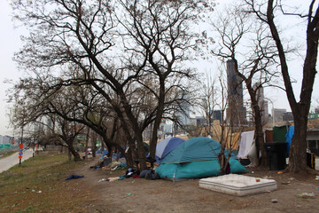 Homeless tent city with Chicago skyline in the background