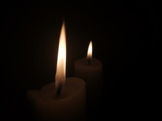 burning candle in the dark