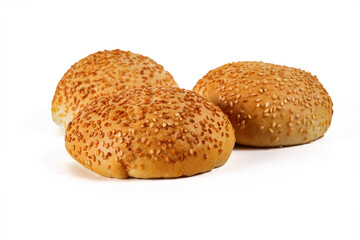 hamburger buns sprinkled with sesame seeds, isolated on a white background