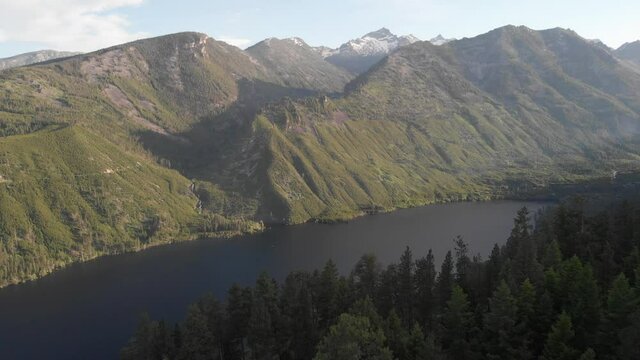 Layered mountain ranges and mountain lake drone 
