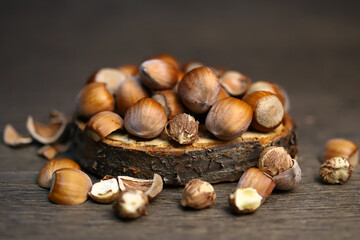 Selective focus. Hazelnuts, peeled and peeled on a wooden surface.