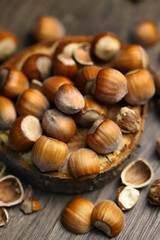 Selective focus. Hazelnuts, peeled and peeled on a wooden surface.