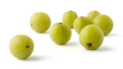 fresh amla or indian gooseberry isolated on white background, high vitamin c contain fruit closeup view, taken in shallow depth of field