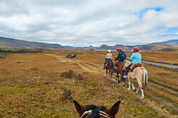 people on horseback in the landscape of the Andes, Cotopaxi