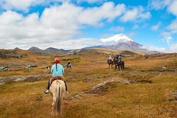 people on horseback in the landscape of the Andes, Cotopaxi - obrazy, fototapety, plakaty