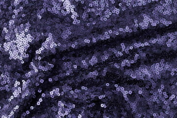 Sequins texture violet color. Fabric background. Blue Granite pantone color 2025 
