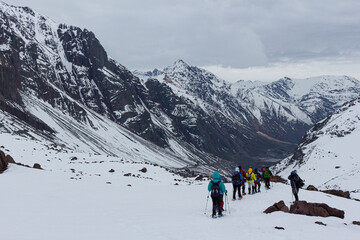 Fototapeta na wymiar Trekking in winter season. Snowed mountains in La Egorda Valley, Cajón del Maipo, central Andes mountain range, Chile